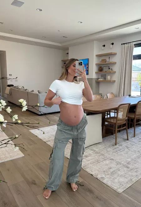 I’m never taking these cargos off throughout pregnancy! This white tee is also a maternity must-have. Wearing size medium. Tap to shop! Cargo Pants Outfit Maternity, Pregnant Streetwear, Flying Pregnant, Maternity Cargo Pants, Pregnancy Pants, Pregnant Outfit, Maternity Overalls, Pregnancy Style, Baggy Cargo Pants