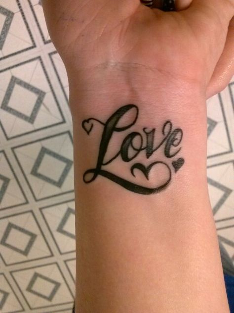 "Love" tattoo! Its in the air, and on her wrist! The Word Love Tattoos, Inner Wrist Tattoos, One Word Tattoo, Faith Hope Love Tattoo, One Word Tattoos, God Tattoos, Love Tattoo, Words Of Hope, Word Love