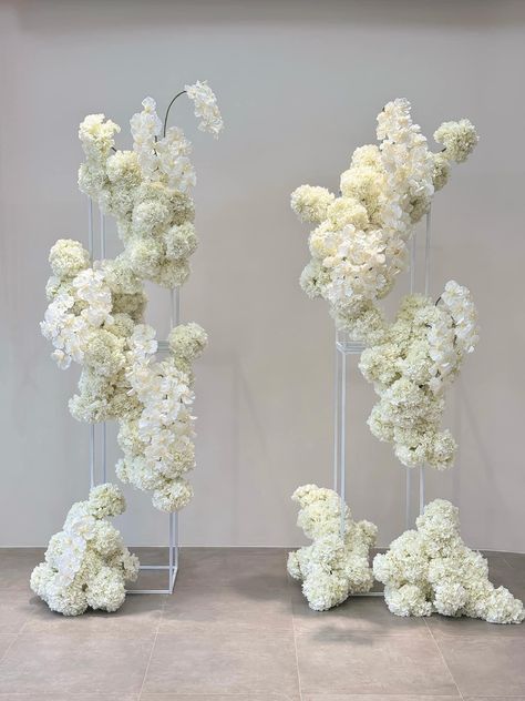 Big White Floral Arrangements, White Flower Backdrop Wedding, Floating Floral Installation, Flower Arch Wedding Ceremony, White Flower Installation, White Flowers Centerpieces, Ceremony Flower Arch, Winter Wedding White, White Floral Arch