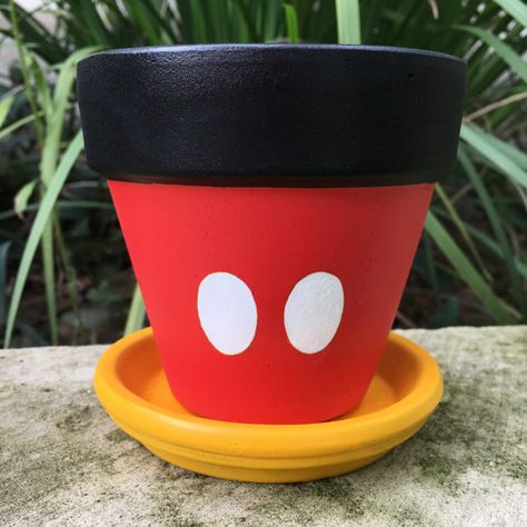 Mickey Mouse inspired flower pot by FlourishAndPots on Etsy Fleur Harry Potter, Plant Pots Crafts, Clay Pot Projects, Flower Pot People, Plant Pot Design, Flower Pot Art, Plant Pot Diy, Painted Pots Diy, Terra Cotta Pot Crafts