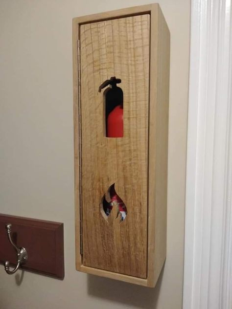 Fire extinguisher box made from red oak. Daughter did the scroll work. Fire Extinguisher In Kitchen, Fire Extinguisher Covers, Kitchen Fire Extinguisher Storage, Fire Extinguisher Liquor Cabinet, Fire Extinguisher Ideas Diy, Fire Extinguisher Ideas, Fire Extinguisher Design, Fire Extinguisher Box Design, Fire Extinguisher Cabinets