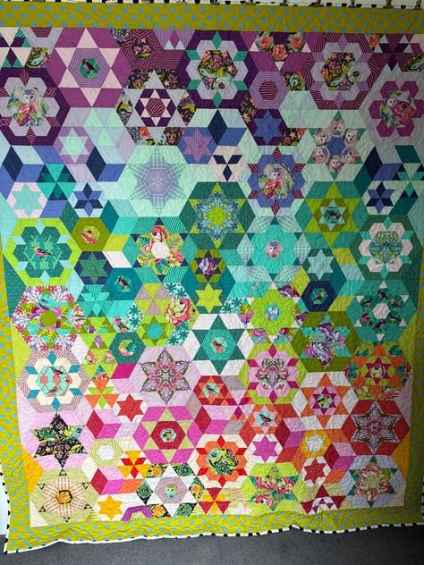 This is Smitten 2, a 16 month BOM from Pink Door Fabrics, with Tula Pink prints.  Hand sewn using the EPP technique, then I have machine quilted it to finish   This quilt is on the more expensive side, but I only charge for materials, not my make time, and this is an expensive quilt to have made! All of my quilts are machine washable, on a 30 degree cool wash and line dried I sell my quilts unwashed, however if you want the more authentic heirloom crinkled look, just give it a wash Smitten Quilt Tula Pink, Smitten Quilt, Paper Peicing Patterns, Tula Pink Quilt, Pink Prints, Pink Quilt, Tula Pink Fabric, English Paper Piecing Quilts, Pink Door