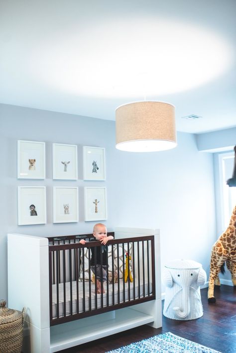 A modern crib for this baby boy's nursery: http://www.stylemepretty.com/living/2016/08/02/14-cribs-that-guarentee-a-knockout-nursery/ Nursery Light Fixture, Modern Safari Nursery, Baby Blue Nursery, Nursery Makeover, Modern Crib, Safari Theme Nursery, Nursery Room Design, Baby Boy Room Nursery, Nursery Modern