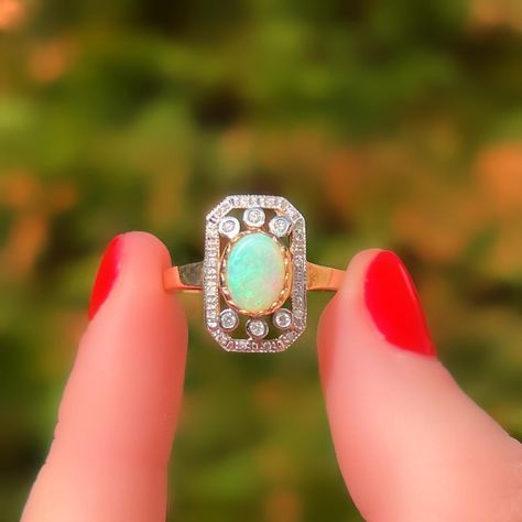 📸NEW PICS of this STUNNING Art Deco-inspired opal and diamond ring – it was time for an update! What do you think?💭 ❤️At the heart of this ring is a striking opal, set in a scalloped yellow gold bezel for a soft, elegant finish. 💎✨Surrounding the opal are shimmering diamonds of varying sizes, adding even more sparkle. Did you notice these diamonds are set in white gold? This contrast enhances their fire and brilliance, how clever?🤓 Currently, she is a UK size O but can be resized. Availa... Opal And Diamond Ring, Ring Art Deco, Art Deco Inspired, Opal Ring, Opal Rings, You Think, Diamond Ring, Opal, Art Deco