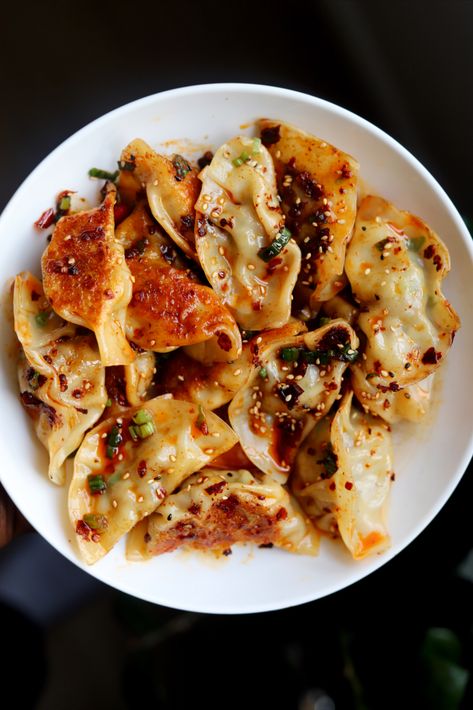 Pork and chive dumplings smothers in delicious chili oil. Dumplings Recipe Chinese, Pork And Chive Dumplings, Chive Dumplings, Pork Dumplings, How To Make Dumplings, Dumpling Filling, Homemade Dumplings, Pork Dumpling, Dumpling Wrappers