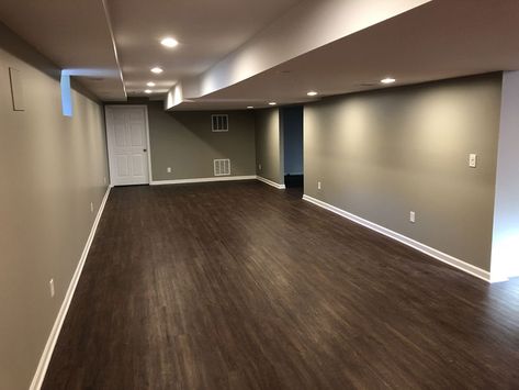 Finished Basement with Hardwood Floors | The Basic Basement Co. Basement With Dark Floors, Basement Hardwood Floors, Basement Dark Floors, Wood Basement, Basement Color, Small Finished Basements, Brown Laminate Flooring, Gray Basement, Dark Brown Floor