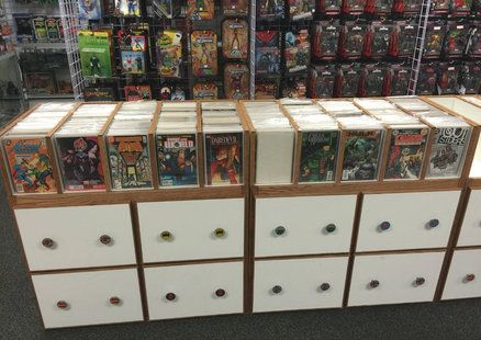 Comic Book Storage Ideas, Comic Book Store Ideas, Comic Book Store Interior, Comic Book Display Shelves, Comic Book Boards For Fabric Storage, Comic Book Organization, Graded Comic Book Display, Comic Book Rooms, Comic Book Box Storage