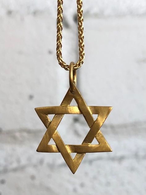 STAR OF DAVID PENDANT, WOVEN 22K GOLD • DESIGNED AND HAND FORGED IN NEW YORK • SIZE 7/8" • AVAILABLE WITH CHAIN - LENGTH AND PRICE VARY Please email info@elihalili.com or call the studio at 212-941-7979 for any inquiries. Black Diamond Bands, Star Of David Pendant, Ancient Coins, Ruby Sapphire, Strand Bracelet, Star Of David, Gold Star, Green Tourmaline, 22k Gold