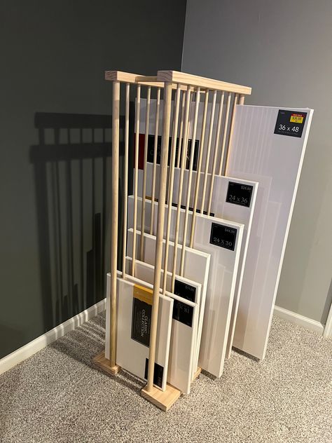 Enclosed Art Storage Rack Made with high quality premium pine and poplar dowels. Several Sizes Available to accommodate a wide variety of canvas sizes.  Pictured in the tallest version, capable of holding canvas up to 48" tall. Photos will be updated to include other sizes soon.  Dimensions are for the shortest version of this rack - 24" Long  - Wider Bottom Section is Approximately 18" wide - 1" Thick Corner Support Dowels attached with screws - Remaining dowel uprights are 1/2" thick - Has Nin Framed Art Storage, Art Storage Rack, Canvas Storage Ideas, Paintings Storage, Art Corner Studio, Artist Studio Storage, Dream Art Studio, Shipping Room, Home Business Organization