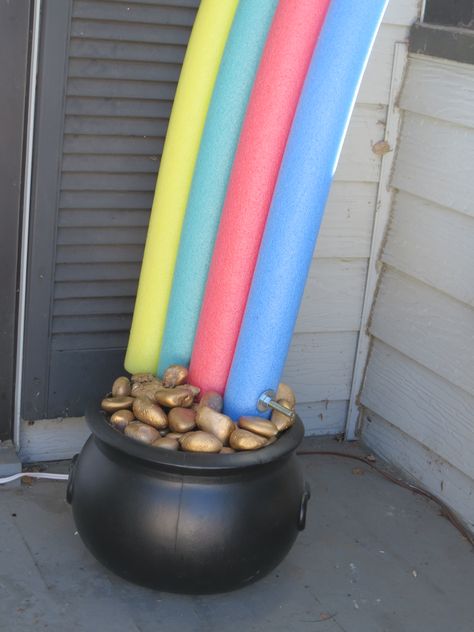 this rainbow and pot of gold easy to make! pool noodles with a long blot and nut to hold it together, paint rocks gold, fill pot with paper or Styrofoam add a cardboard top to place gold rocks on and done! Fancy Candle Holders, Sant Patrick, Door Decorating Ideas, St Patricks Decorations, St. Patrick's Day Diy, Pool Noodle Crafts, St Patricks Day Decor, St Patricks Crafts, San Patrick