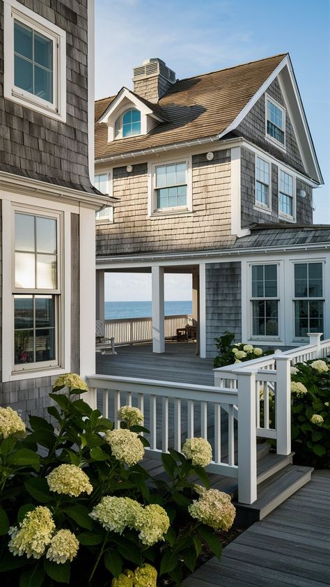 Step into coastal serenity with this exquisite seaside retreat! 🌊✨ Hillside Beach House, Nantucket Coastal Style, Coastal Maine Homes, Seaside House Exterior, Key West Style Homes Exterior, Beach Cottage Style Exterior, Beach House Front Porch, Coastal Exterior House Colors, Beach Cottages Exterior