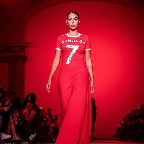 Cristiano Ronaldo’s wife, Georgina Rodriguez, made a significant appearance at Paris Fashion Week, walking for Vetements in a red dress that merged football jersey elements with an elegant pleated train skirt, reflecting her bond with the football legend. This event marked Vetements’ decade in the industry, attracting widespread attention and featuring a range of oversized and distinctively styled pieces​​. Photos: @vetements_official #gclasslife #carswithclass #luxlife #luxurylifestyle #B... Train Skirt, Georgina Rodriguez, Football Jersey, Football Jerseys, Cristiano Ronaldo, Luxury Lifestyle, Ronaldo, Paris Fashion, Paris Fashion Week