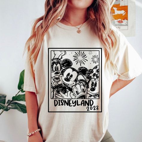 Unisex Short Sleeve Tee - Materials: 100% Cotton. Otton Medium-Heavy Fabric (8.0 Oz/Yd (271.25 G/M)) - Size: S,M,L, Xl, 2xl - Loose Fit - Sewn In Label - Runs True To Size Disney Summer Shirt With Letter Print, Disney Trips Character Print Short Sleeve Shirt, Short Sleeve Shirt With Character Print For Disney Trips, Disney Trips Graphic Tee With Character Print, Mickey Mouse Shirt For Disney Fan Events In Summer, Character Print Graphic Tee For Disney Trips, Summer Crew Neck Shirt For Disney Fan Events, Disney Graphic Print Shirt For Disney Trips, Disney Style Graphic Print Shirt For Disney Trips