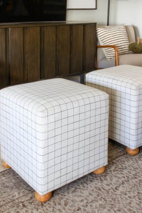 I starting researching to see if I could recreate the look for way less. And you guessed it – I totally could! Come see how I did it: https://inspirationformoms.com/diy-footed-cube-ottoman/ #diytutorial #lookforless #ottoman #homedecor Pouf Seating, Cube Seat, Diy Pouf, Diy Stool, Diy Ottoman, Small Ottoman, Modern Ottoman, Square Pouf, Cube Ottoman