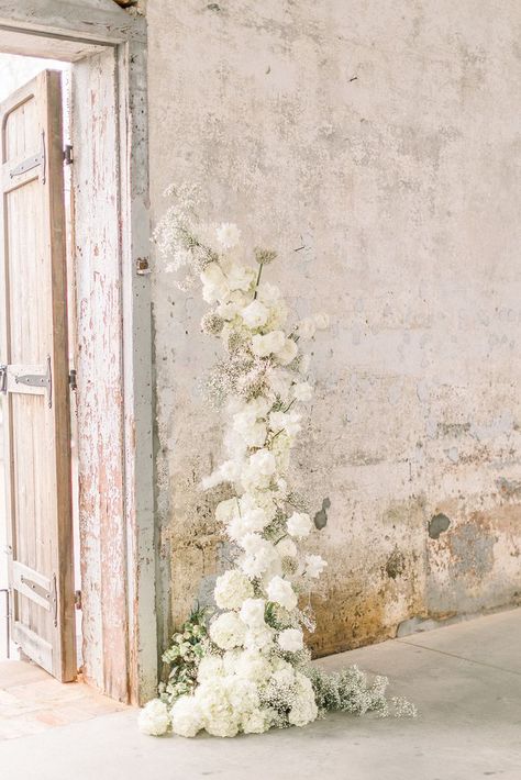 Foam Free Monochromatic All White Wedding Ceremony Floral Arch with hydrangeas, baby's breath, reflexed white Akito roses, ranunculus and allium All White Wedding Ceremony, Wedding Ceremony Floral Arch, Ceremony Floral Arch, Monochromatic Wedding, White Wedding Arch, Gypsophila Wedding, White Wedding Ceremony, Wedding Alters, Floral Arch Wedding