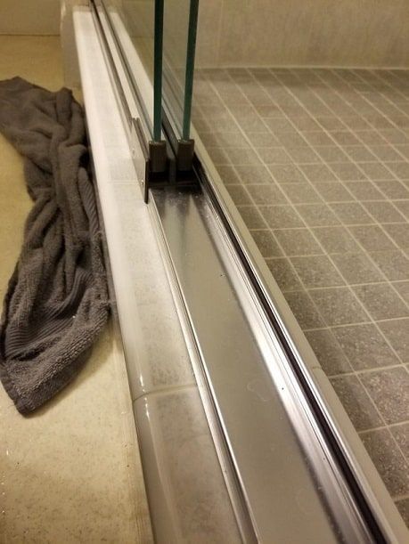 Clean Shower Door Track, How To Clean Shower Door Tracks, How To Clean A Glass Shower Door, Cleaning Shower Door Tracks, How To Clean Glass Shower Doors Bathroom, How To Clean Shower Doors, Sliding Shower Door Makeover, Clean Shower Door, Shower Door Cleaning