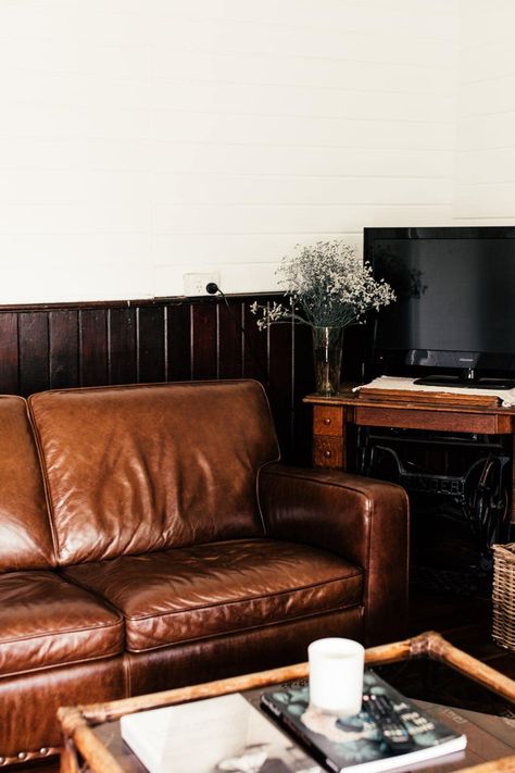 The classic dark brown leather sofa has served as a stereotypical focal point in the living room for decades. If not properly designed and utilized, l... | Don’t Forget Flowers #DarkBrownLeatherSofa #DarkBrownLeatherSofaDecorating #LeatherSofa #BrownLeatherSofa Deep Brown Sofa Living Room Ideas, Small Living Room Brown Leather Sofa, Leather Couch Dark Wood Floors, Brown Leather Sofa Styling, Brown Leather Sofa Aesthetic, Chestnut Leather Couch, Mixing Leather Furniture Colors, Dark Brown Sofa Color Scheme, Dark Brown Leather Couch Living Room