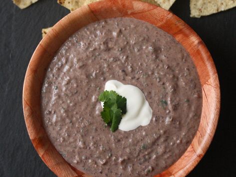 A little sour cream goes a long way in this simple black bean dip recipe. 1.26.2020 - I was looking for something similar to Gloria's restaurant black bean dip. This is not exactly the same but it is really good. Even my "I hate beans" child gobbled it up. Pureed Black Beans, Black Bean Puree, Bean Dips, Black Bean Dip Recipe, Bean Dip Recipe, Easy Super Bowl, Bean Dip Recipes, Black Bean Dip, Caramelized Onion Dip