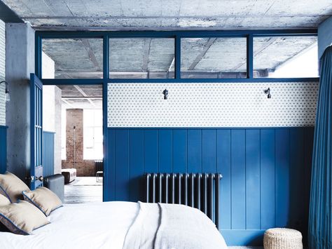 An Old Upholstery Factory Gets a Fresh Coat of Blue Paint Photos | Architectural Digest Bright Blue Bedrooms, Bleu Pantone, Borrowed Light, Blue Interior Design, Warehouse Home, Industrial Apartment, Amsterdam Houses, Clerestory Windows, Glass Doors Interior