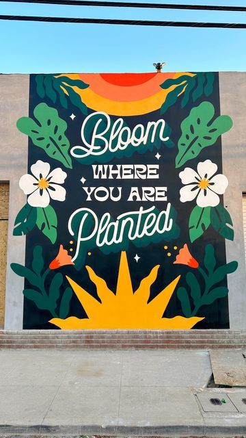 Steffi Lynn on Instagram: "Bloom where you are planted in 📍Ontario, California for a new home decor retail shop coming sooooon! I rarely use black backgrounds but after this mural I think it might be my new thing?! 🌴🌸🌺" Steffi Lynn Mural, This Must Be The Place Mural, Murals With Words, Sel Projects, Mural Business, Mural Art Ideas, California Background, Draw Room, Plant Mural