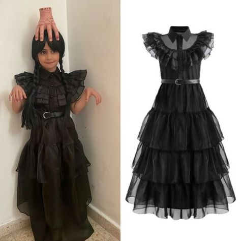 Wednesday Addams Kids Cosplay Dress Snap! Crackle! Pop! This Halloween reveal your inner demonic side with Wednesday Addams cosplay outfit because It's Wednesday Addams time of the year! 👻🖤 This dress features a classic black silhouette with ruffles and a belt, plus a wig with braids to complete the costume. Add the included hand prop to complete your Wednesday Addams look! 👻 Our kid's cosplay dress for Halloween is perfect for channeling your inner goth queen. 🖤 Shop now and get ready to sla... Wednesday Halloween Costume, Wednesday Halloween, Wednesday Addams Cosplay, Wednesday Addams Dress, Wednesday Addams Costume, Cosplay Photoshoot, It's Wednesday, Gothic Princess, Unique Costumes