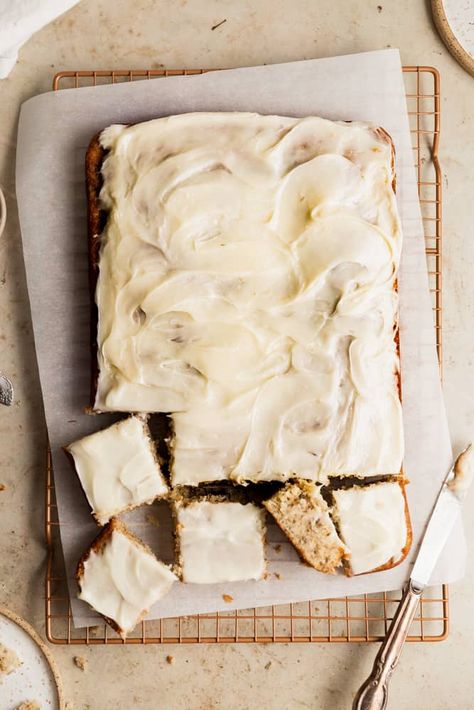 This banana cake is made with oil for a super moist and fluffy texture. The cake is super easy to make and is topped with a tangy and delicious cream cheese frosting. This is the perfect cake to make when you have extra spotty bananas lying around! #bananacake #banana #bananarecipes #bananas #frostingandfettuccine Banana Cake With Oil, Carrot Sheet Cake, Moist Banana Cake, Coffee Buttercream, Banana Cupcakes, Banana Cake Recipe, Coffee Cookies, Sheet Cakes, Delicious Cream