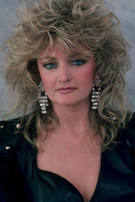 June 8, 1953: Bonnie Tyler is born Gaynor Hopkins in Skewen, Neath, Wales. Recognized for her distinctly raspy voice and soulful pop repertoire, she had her first worldwide hit in 1978 with "It's a Heartache" from her second album, Natural Force. 1980s Hair, The Heart, Bonnie Tyler, Hair Cuffs, Ponytail Bun, 80s Hair, Stunning Hairstyles, Shag Hairstyles, Total Eclipse