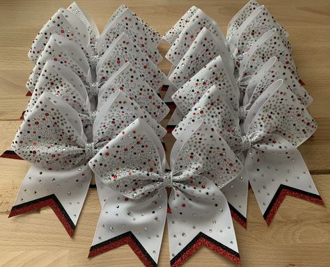 White team cheer bows with scattered clear, red and black rhinestones Red And White Cheer Bows, White Cheer Bows, Bling Cheer Bows, Cute Cheer Bows, Cheerleading Ideas, Cheer Backpack, Competition Bows, Rhinestone Transfers Design, Team Cheer