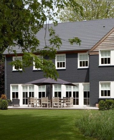 Should I Paint my House Charcoal? Grey Painted Brick, Brick Paint Colors, Grey Exterior House Colors, Painted Brick Exteriors, Exterior Gray Paint, Gray House Exterior, Best Exterior Paint, Houses Architecture, Painted Brick House