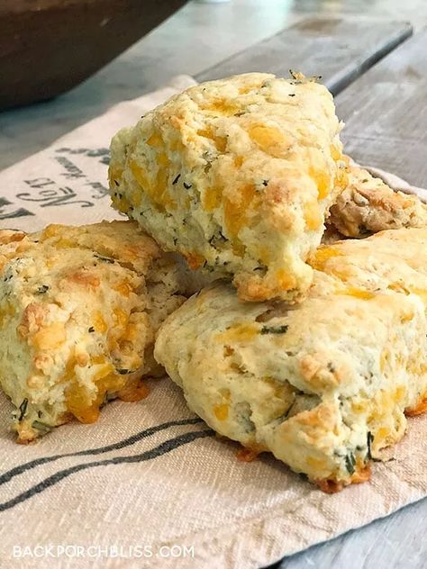 I’ve been experimenting with scones– both sweet and savory– and this is my favorite so far. Because, um, fresh rosemary. And cheese. This recipe* would be ideal for brunch during any season– Graduation, Wedding Shower, Easter or Christmas. I was able to use fresh rosemary from my garden, which makes me love them even more. They are also yummy paired with a soup or salad for an easy weeknight dinner. You can even split the batch and freeze half of them before baking. Preheat the oven… Rosemary Scones, Savory Scones Recipe, Fall Saturday, Cheddar Scones, Mini Scones, Cranberry Orange Muffins, Scones Ingredients, Savory Scones, Scone Recipe