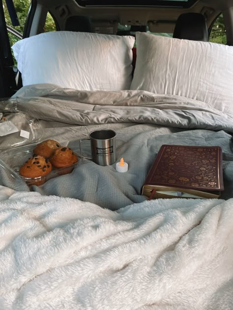 Bed in car, with cozy blankets, chocolate chip muffins, a Bible, a candle, and a camping cup filled with coffee Camping Inspiration, Camping Aesthetic, Fall Camping, Camping Camper, Camping Mattress, Car Bed, Sleeping Under The Stars, Camping Bed, Camping Adventure