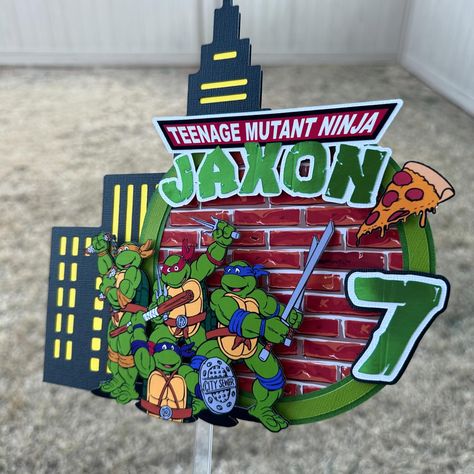 Ninja Turtles Cake Topper 🐢💚 #ninjaturtles #ninjaturtlescake #ninjaturtlesparty #ninjaturtlesdecoration #ninjaturtlestoys #ninjaturtlestheme #caketopper #turtlecake #turtlecaketopper #ninjaturtlesmovie Ninja Turtles Cake Topper, Ninja Turtle Birthday Decorations, Ninja Turtle Cake Topper, Cricut Ninja Turtle Birthday, Ninja Turtle Shell Svg, Ninja Turtle Decorations, Ninja Turtle Food Labels, Ninja Turtle Birthday Shirt, Ninja Turtle Theme