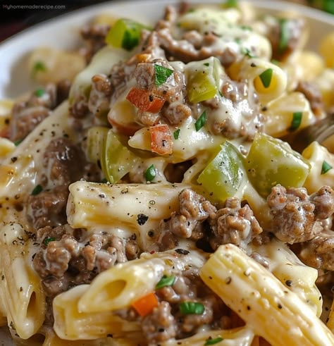 Experience the delightful fusion of juicy steak, creamy cheese, and al dente pasta with our Philly Cheesesteak Pasta. A perfect blend that promises to bring coziness to any meal. Philly Cheese Steak Pasta Ground Beef, Philly Cheesesteak Pasta, Cheesesteak Pasta, Rigatoni Recipes, Steak Pasta, Pasta Penne, Cooked Pasta, Weekday Dinner, Beef Pasta