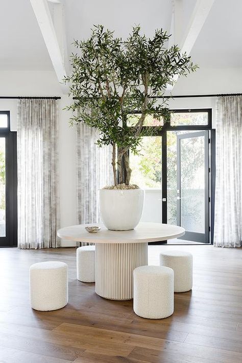 Foyer Round Table, Round Entry Table, White Round Table, Tall Potted Plants, Transitional Home Design, Chic Backyard, Backyard Features, Potted Olive Tree, Round Marble Table