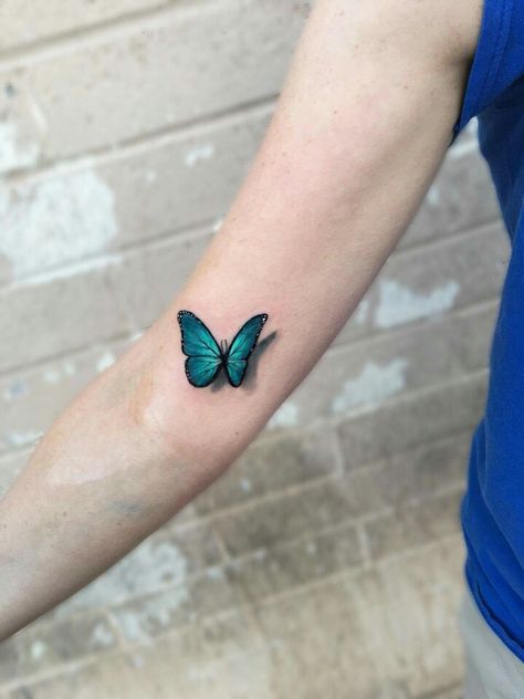 Amazing blue morpho, 3d realistic tattoo done by Kaitlin Dutoit at Ink Snob Studio in Glendale, AZ. Blue Color Tattoo, Blue Morpho Butterfly Tattoo, Morpho Butterfly Tattoo, Tato 3d, Realistic Butterfly Tattoo, 3d Butterfly Tattoo, Blue Butterfly Tattoo, Butterfly Tattoo Meaning, Bright Tattoos