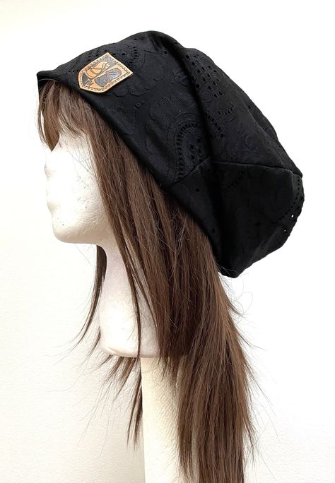 Black Slouchy Beanie Oversized Black Winter Hat Drape Hat Black Winter Baggy Hat. One of a kind winter hat. It is our promise that you will not find this hat anywhere else. This is a neutral gender, oversized beanie made with black knit fabric with lace pattern. This hat is light weight, roomy, soft and stretchy. It will fit all age groups. It makes for a perfect solution to bad hair days. Care instruction: Hand wash or machine wash in gentle cycle. Air dry only. Oversized Beanie Hat, Beanie Reference, Cute Black Beanie (one Size Fits Most), Black Slouchy One Size Hat, Adjustable Black Harajuku Style Hat, Black Slouchy Beanie, Black Winter Hat, Oversized Beanie, Summer Beanie