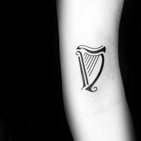 Minimalist Small Forearm Mens Harp Tattoo Designs Guinness Harp Tattoo, Guinness Tattoo, Irish Harp Tattoo, Ireland Tattoos, Small Irish Tattoos, Dublin Tattoo, Harp Tattoo, Celtic Tattoos For Men, Ireland Tattoo