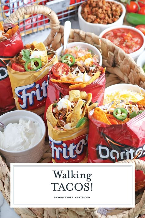 Portable & perfect as a snack, appetizer or party dish, Walking Tacos are totally delicious! Just pile taco toppings on top of your favorite bag of chips! #walkingtacos #walkingtacobar #bestwalkingtacos www.savoryexperiments.com Tacos In A Bag, Walking Taco Bar, Walking Tacos Recipe, Flank Steak Tacos, Taco Bar Party, Walking Taco, Easy Taco Recipes, Taco Toppings, Walking Tacos