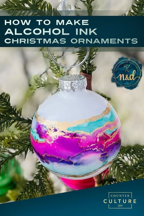 Learn how to make alcohol ink Christmas ornaments. These DIY Christmas ornaments are uniquely beautiful. We give you the video tutorial, supply list, and step by step instructions! Making Alcohol Ink, Alcohol Ink Christmas Balls, Poured Paint Christmas Ornaments, Alcohol Ink Glass Ornaments, Alcohol Ink Baubles, Alcohol Ink Crafts Tutorials, Alcohol Ink Vase, Diy Alcohol Ink Ornaments, Diy Glass Ornament Ideas