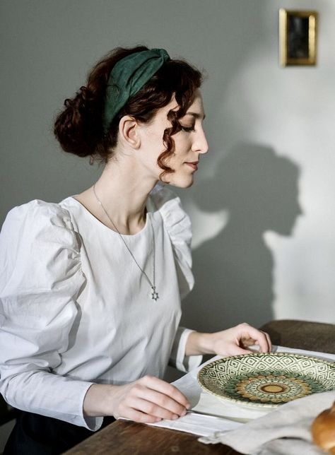 Sitting At A Table Pose, Jewish Girl Aesthetic, Sitting At Table Pose Reference, Shabbat Dinner Table, Woman Sitting At Table, Jewish Aesthetic, Jewish Women Fashion, Sitting At Table, The Best Haircut