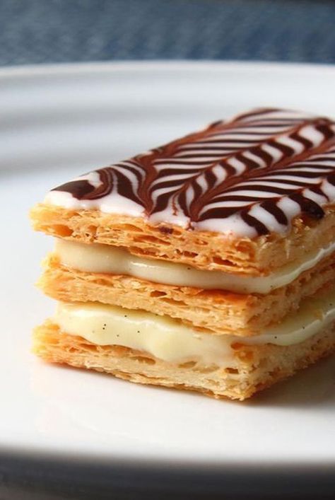 Make Napoleon dessert with Chef John's recipe that uses frozen puff pastry sheets baked perfectly crisp, light, and flaky for layering with cream. #dessertrecipes#dessertideas#dessertdishes#dessertinspiration#sweettreats#bars#dessertbars#barrecipes Napoleon Pastry, Easy Puff Pastry Desserts, Napoleon Dessert, Chef John Recipes, Napoleon Cake, Pastries Recipes Dessert, Classic French Desserts, Puff Pastry Desserts, Easy Puff Pastry