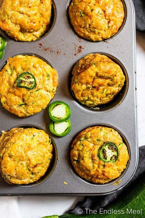 These zucchini cornbread muffins will take your dinner to the next level! They're moist, cheesy, and slightly sweet with a hint of heat from minced jalapeño. We serve them with homemade chili honey butter, and it's all ready in just 35 minutes! #theendlessmeal #cornbread #chili #snack #sidedish #zucchini #comfortfood #vegetarian #muffins Healthy Cornbread Muffins, Cornbread Breakfast, Vegetarian Muffins, Cornbread Chili, Zucchini Cornbread, Healthy Cornbread, Chili Honey, Cornmeal Muffins, Zucchini Corn