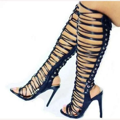 Step up your shoe game with these 🔥 Sexy Shiny Strappy Black Gold Cross Tie Knee High Woman Gladiator Long Sandals Boots 🔥 Perfect for summer vibes and elevated style 👌🏼✨ #gladiatorsandals #summerboots #sexyshoes #shinysandals #strappyboots #kneehighs #thinsandals #cutouts #goldaccents #fashionforward Woman Gladiator, Knee High Sandals, Sheer Leggings, Gladiator Boots, Lace Up Gladiator Sandals, Goth Shoes, Boots Female, Heels Summer, Big Legs