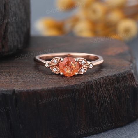 Vintage Sunstone engagement ring Solid Rose gold Milgrain Leaf ring Lab Grown Diamond ring Bridal Promise Anniversary ring for woman Details of The Rings: Main stone: Round cut Sunstone Size: 5mm Side stone: Lab Grown Diamonds Carats: about 0.03ct Color: D-F  Clarity: VS Band width:1.5mm Band thickness:1.2mm The metal is solid gold, 14k/18k rose gold, yellow gold and white gold can be selected from the drop menu. All ring sizes and metal can be made, if you couldn't find the ring size or metal y Sunstone Engagement Ring, Leaf Ring, Gold Plated Rings, Ring Sizes, Engraved Rings, Anniversary Ring, Eternity Bands, Custom Rings, Gold Yellow