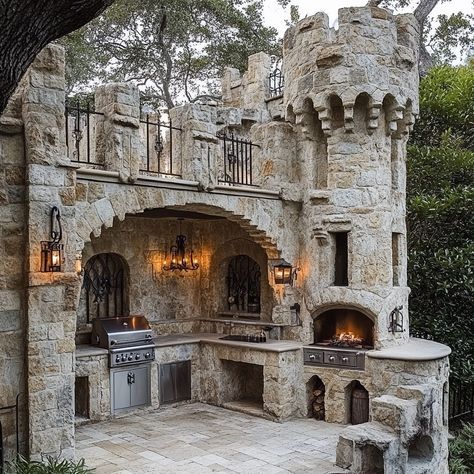 This castle-inspired outdoor kitchen merges medieval charm with modern functionality, creating a majestic space for outdoor cooking and entertaining. Featuring stone-clad walls, arched doorways, and wrought-iron accents, the design evokes the grandeur of an ancient fortress. A central stone hearth serves as the focal point, perfect for open-fire cooking, while Gothic-style lighting and a turreted pizza oven add to the old-world ambiance. Ideal for hosting grand feasts, this kitchen offers a u... Castle Chambers, Rustic Castle, Castle Turret, Ancient Fortress, Castle Kitchen, Medieval Kitchen, Tiny Castle, Castle Kitchens, Stone Hearth