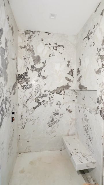 Epic Ceramic & Stone on Instagram: "That’s how a dream shower is created. 💭 Using a Dover White marble slab. ⠀⠀⠀⠀⠀⠀⠀⠀⠀ Builder: @building_worx_inc Architect: @lcra_architects ⠀⠀⠀⠀⠀⠀⠀⠀⠀ #epicceramicandstone #epicinstallation . . . . #whitebathroom #interiordesignideas #bathroominspo #bathroomgoals #bathroomstyling #bathroomdesigns #bathroomdecor #titlestyle #tilelove #walltiles #bathroomdecor #tilework #ocinteriordesigner #ocinteriordesign #ocdesign #californiacasual #interiordesign #ceramiand Dover White Marble, White Marble Bathroom, Dover White, Dream Shower, Bathroom Decor Luxury, Bathroom Goals, Marble Slab, Decor Luxury, Tile Work