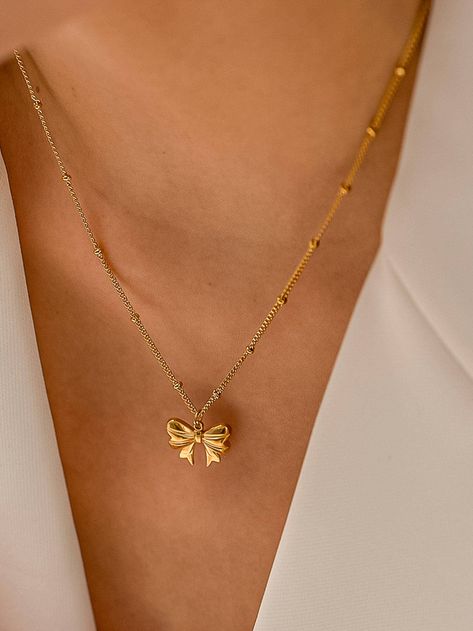 18K Gold Non-Tarnish Bow Necklace 18K Gold Plating Stainless Steel Pendant Size (inch): 0.5 Chain Length (inch): 15.5 Extension Length (inch): 2