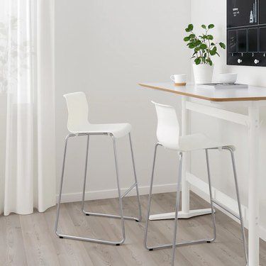 9 Barstools Under $100 That Will Instantly Give You More Seating | Hunker Affordable Bar Stools, Bar Furniture For Sale, Kitchen Counter Chairs, White Bar Stools, White Bar, Ikea Chair, Eames Chairs, Design Line, Counter Chairs