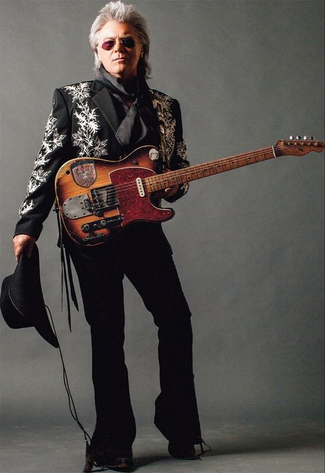 John Marty Stuart (born September 30, 1958) is an American country and bluegrass music singer, songwriter, and musician. Active since 1968, Stuart initially toured with Lester Flatt, and then in Johnny Cash's road band before beginning work as a solo artist in the early 1980s. His greatest commercial success came in the first half of the 1990s on MCA Records Nashville. Stuart has recorded over 20 studio albums, and has charted over 30 times on the Billboard Hot Country Songs charts. Clarence White, Sonny Chiba, Max Rockatansky, Marty Stuart, Hot Country Songs, Cult Of Personality, Bluegrass Music, Country Music Stars, Country Stars