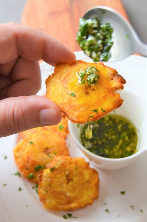 Tostones with garlic mojo I don’t know if you have had tostones before (twice fried green plantains) but if you haven’t get your platanos as quickly as you can. Tostones are the comparable to French fries for people living in Latin America specially in the Caribbean. Tostones are green plantains that are fried, then smashed to...Read More Green Plantains, Carribean Food, Plantain Recipes, Puerto Rico Food, Boricua Recipes, Cuban Cuisine, Colombian Food, Spanish Dishes, Hispanic Food